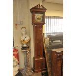 A walnut long case clock, the brass dial with roman numerals, with a second subsidiary dial,