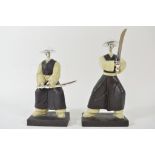 A pair of composition figures in the form of Japanese swordsman