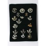 A collection of seventeen various light infantry badges some of which are retrospective copies