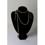 A collection of pearls with silver clasps