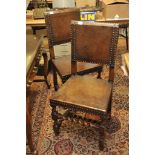 A set of six oak and leather dining chairs with barley twist supports