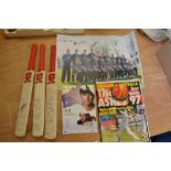 A collection of cricket memorabilia including miniature cricket bats signed by 12 players from the