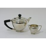 A silver tea pot and matching jug Birmingham hallmarks