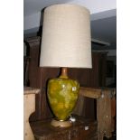 A modern design table lamp of inverted baluster form and with a mottled green finish.