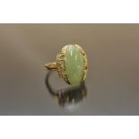 A gold tone ladies ring,