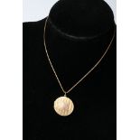 A 9ct gold pendant with a chain