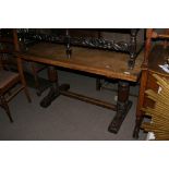 An oak refectory table the rectangular top on turned supports with an extra end support and a set