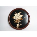 A similar round Japanese plaque with raised decoration of flowers and foliage - 42 cms