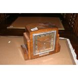 A walnut mantel clock of Art Deco design