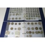 Two blue albums containing commonwealth and European coinage,