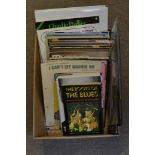 A box containing a collection of books, music sheets, Beat Instrumental magazines,
