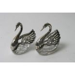 A further pair of swan shaped  glass and silver salts with star cut bases
