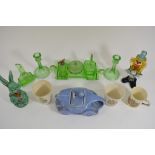 A collection of glass and ceramics including an Art Deco green glass dressing table set,