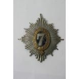 An original helmet plate of the 7th Dragoons, 4 post fitting,