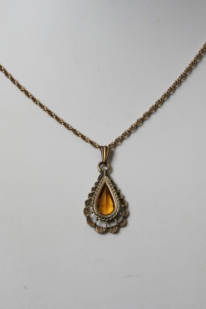 A silver gilt pendent with attached 9ct gold chain