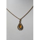 A silver gilt pendent with attached 9ct gold chain