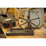 A small antique spinning wheel