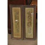A pair of framed and glazed Chinese silk sleeves depicting figures in a garden setting.