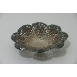 A small silver flower shaped dish