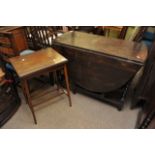 A small Edwardian inlaid card table and an oak barley twist drop leaf table