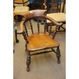 A late Victorian Elm and beech chair with turned supports