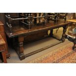 A large oak refectory table the rectangular top on bulbous legs