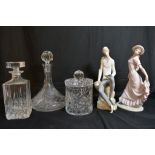 Two cut glass decanters and a biscuit barrel plus Lladro and Nao figures