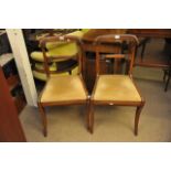 A pair of Victorian chairs with drop in seats.