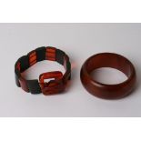 An early plastic bracelet formed as a belt and a bangle,