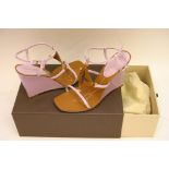 A pair of ladies Louis Vuitton Capricieuse patent wedge sandals in brown and lilac,