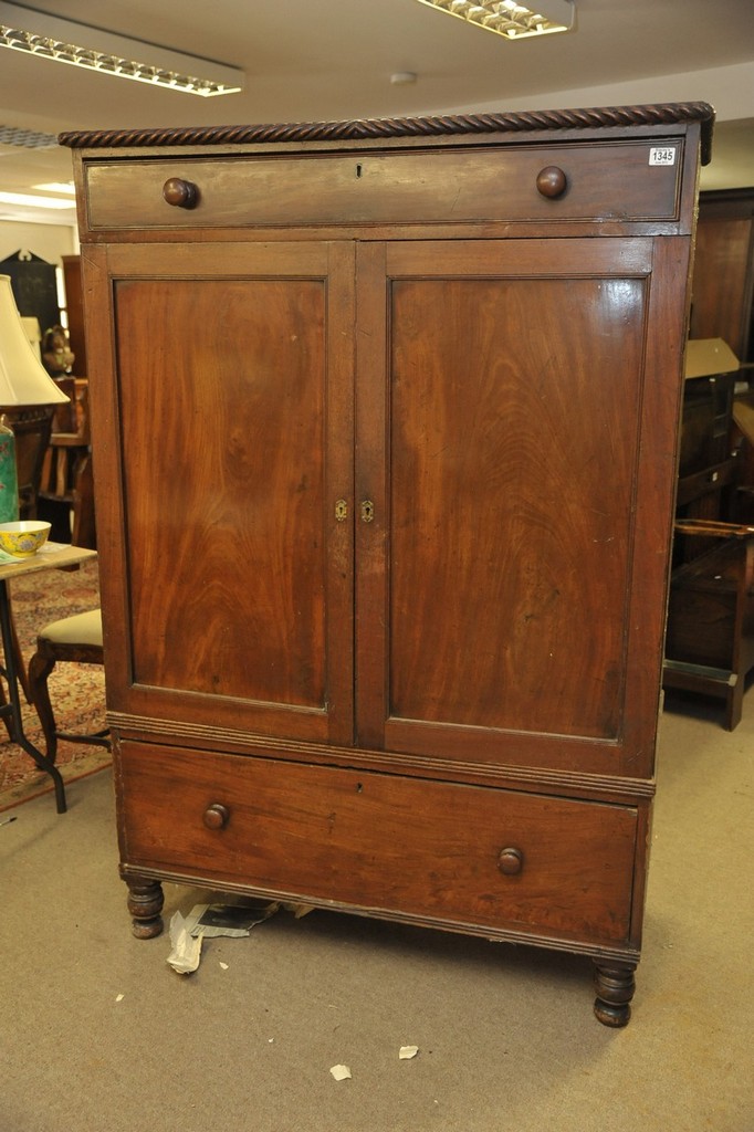 A William IV mahogany linen press having rope moulding's above a single drawer,