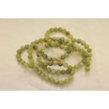 A 20th century jade bead necklace ,