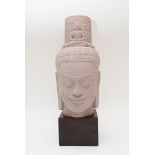 An impressive sandstone head of Lokeshvara inspired by the "Radiant Lokeshvara" from the Prah Kan