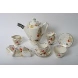 A Clarice Cliff style part coffee set by Tams ware titled 'Woodland'. Approx 13 pieces.