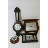 A collection of four wall barometers