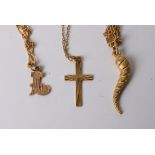 A 9ct gold  Horn of LIfe pendant and chain and a gold cross