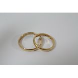 Two gold wedding bands