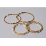 Two pairs of large 9ct gold hoop earrings