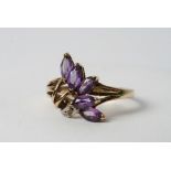 A 9ct gold amethyst and chip stone diamond ring