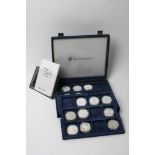 A collection of 26 silver proof coins in presentation case.