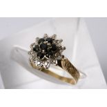 A 9ct gold ladies cluster ring inset with blue sapphires and chip diamonds