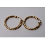 A pair of 9ct gold spiral hoop earrings