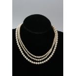 A collection of simulated pearl necklaces