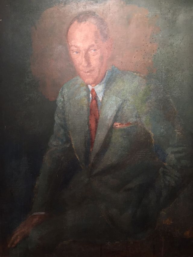 John Wheatley, 20th century, portrait of a suited gentleman, oil on canvas 101cm x 76cm.