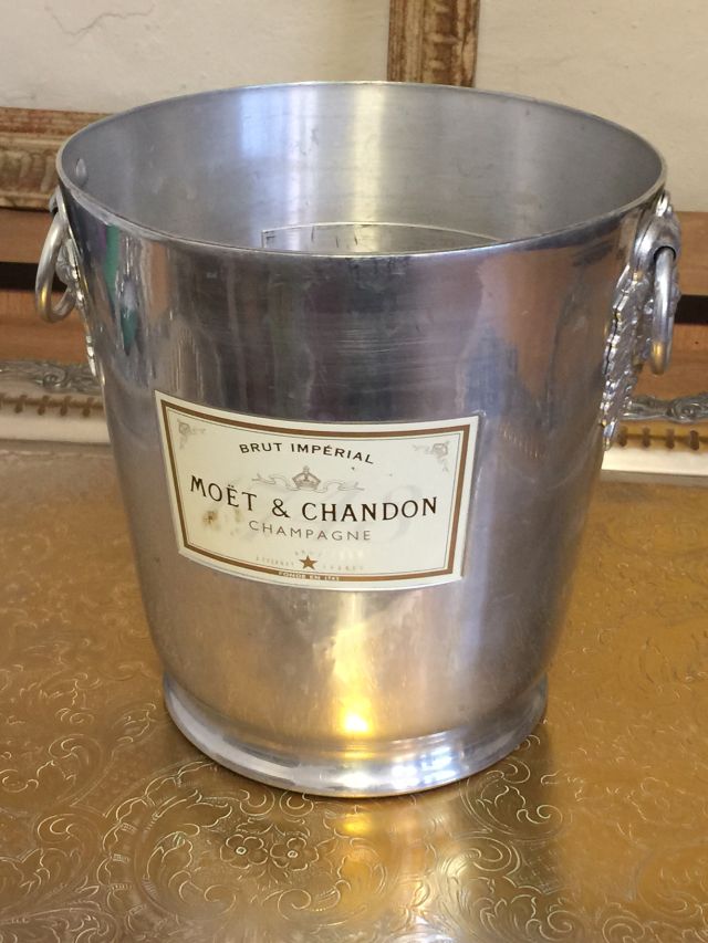 Moet et Chandon, vintage Champagne ice bucket, with two handles with vine leaf mouldings.