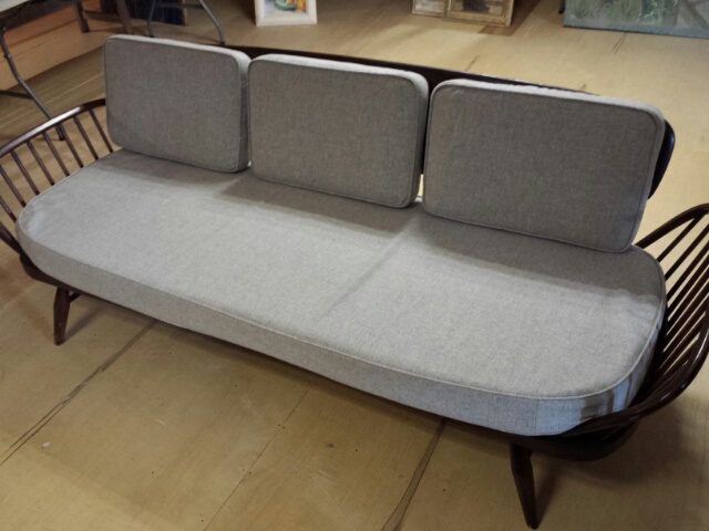 Ercol day bed / studio couch. Upholstered in mid grey 100% wool, with new webbing. Overall 2.08m