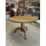 Circular mid 20th century pine breakfast table with tripod centre leg. 106 cm diameter, 75 cm high.