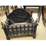 Vintage cast iron fire basket with decorated back panel, bottom plate removes for cleaning.