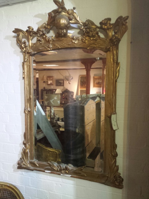 Large heavily gilded French mirror, 1920's Art Deco period, bevelled glass