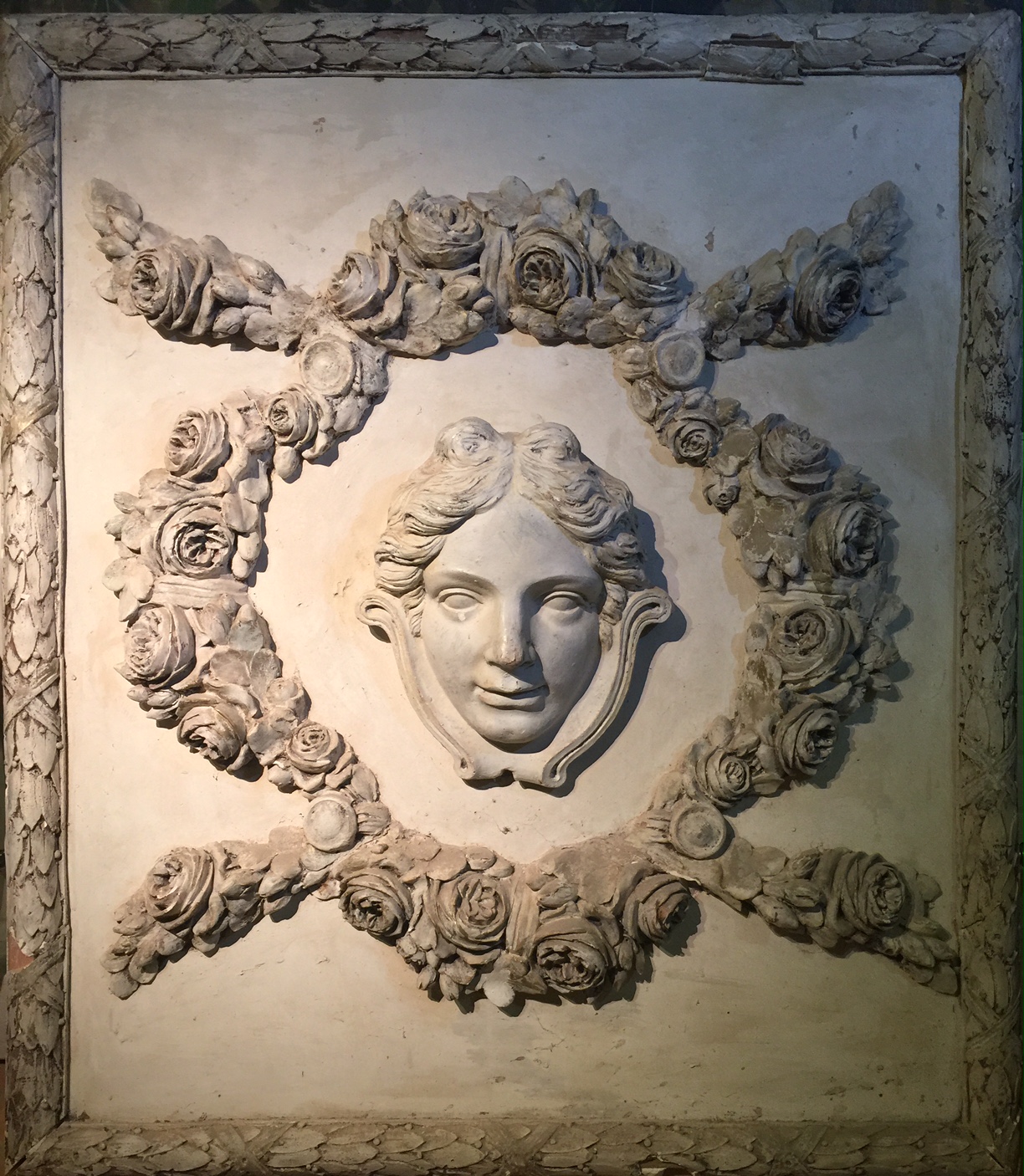 Large plaster relief classical female within ornate scrolled moulded frame. 140cm x 120cm.